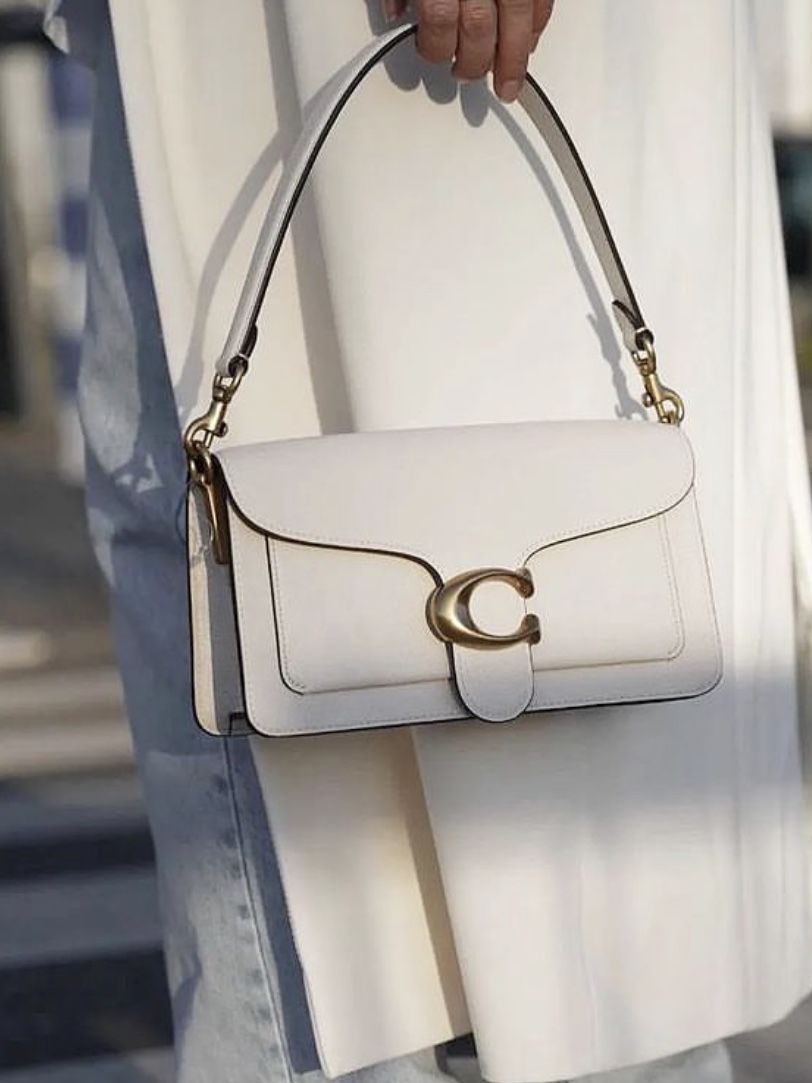 Soft Beige Handbag - front view being carried